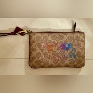 Coach Wristlet with Dinosaur Design